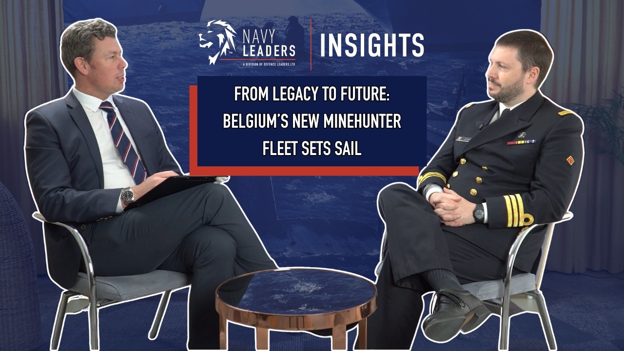 Video Thumbnail for "From Legacy to Future: Belgium’s New Minehunter Fleet Sets Sail". The image includes two men sat down facing each other. One man is in a suit, whilst the other is in a naval uniform.