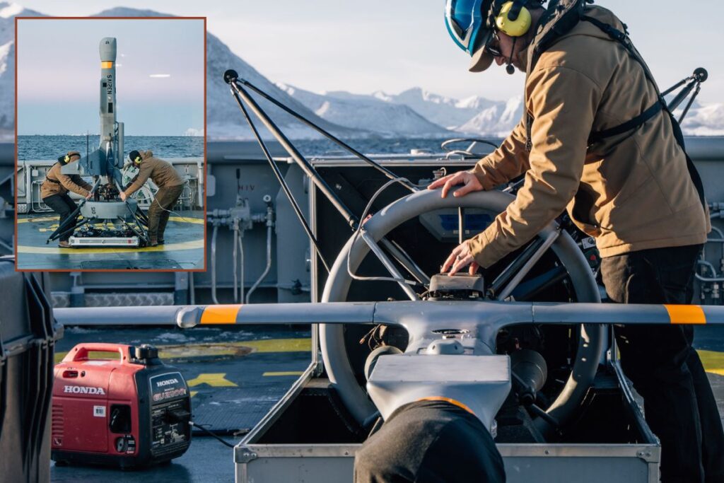 Engineers readying the V-BAT for flight aboard KV Olav Tryggvason.