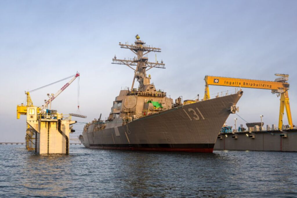 Flight III Arleigh Burke-class destroyer the future USS George M. Neal entering the water for the first time.