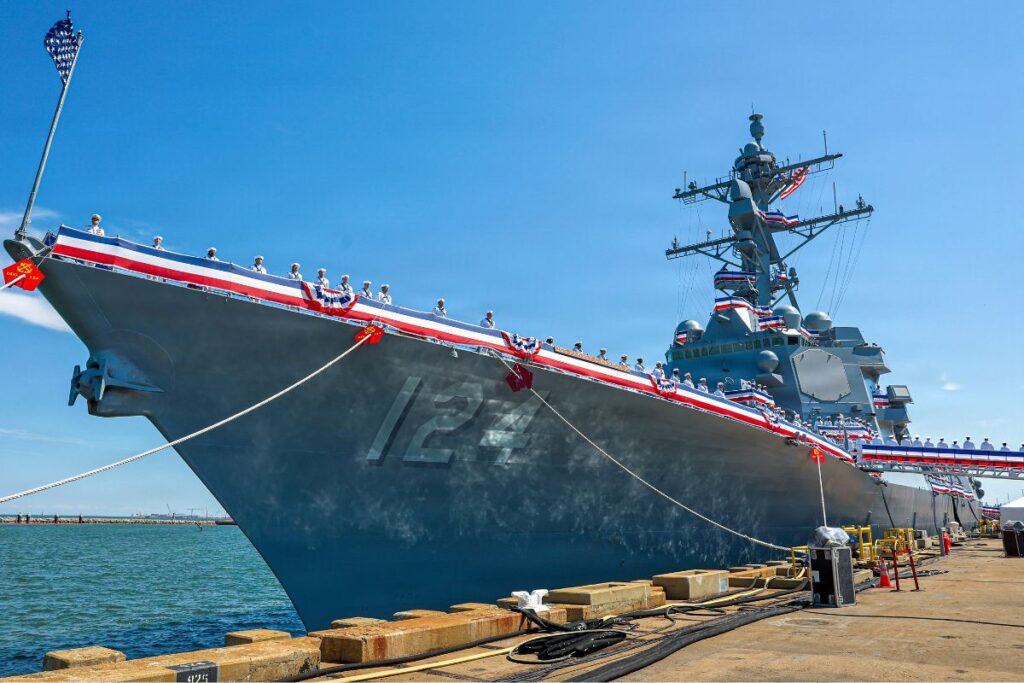 Sailors man the rails aboard the U.S. Navy’s newest Arleigh Burke-class guided-missile destroyer USS Harvey C. Barnum Jr. during her commissioning ceremony in Norfolk, Virginia.