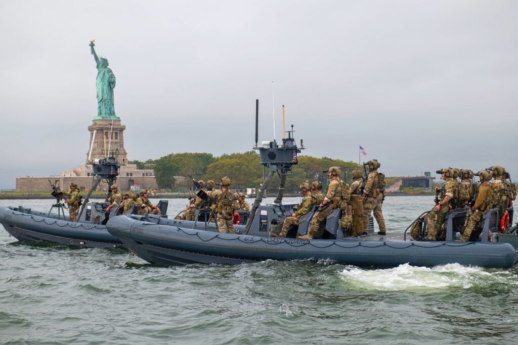 Two USGC Maritime Security Response Team (MSRT) crews on watch near the Statue of Liberty in New York Harbor in September 2025 during the U.N. General Assembly.