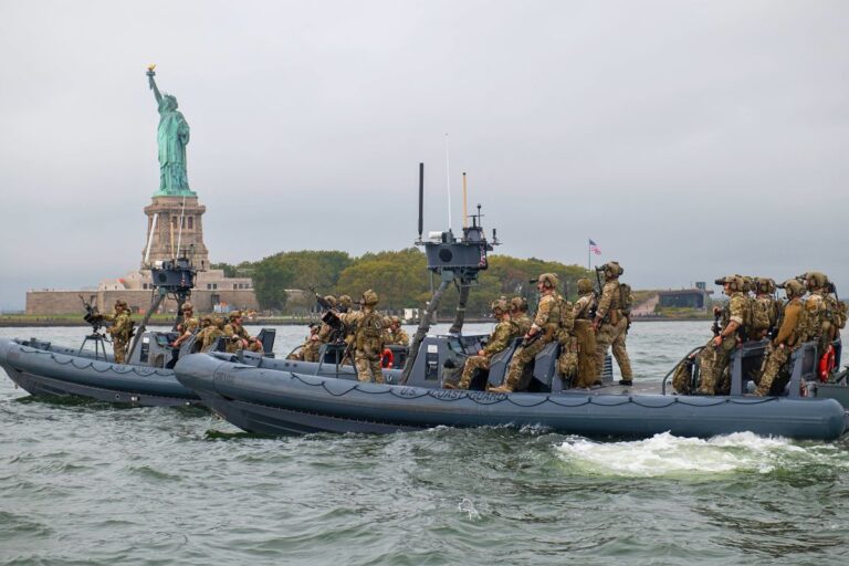 Two USGC Maritime Security Response Team (MSRT) crews on watch near the Statue of Liberty in New York Harbor in September 2025 during the U.N. General Assembly.