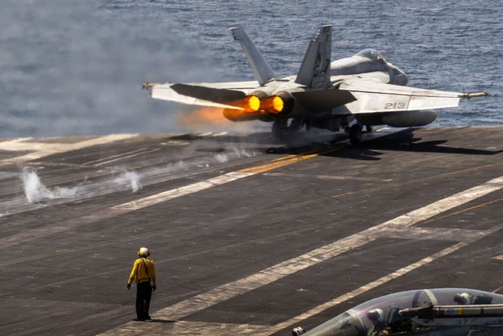 A fighter jet launches from aircraft carrier USS Abraham Lincoln in the Arabian Sea.