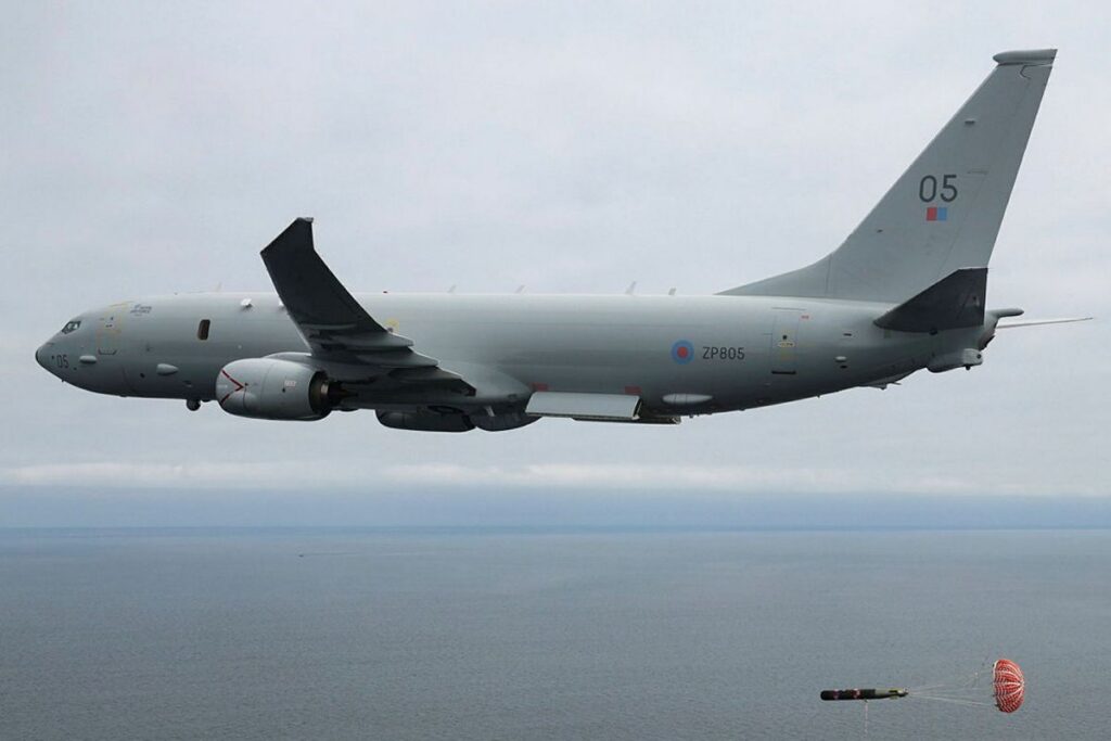 Denmark is set to acquire two P-8A Poseidon MPAs similar to this aircraft, an RAF plane pictured releasing a torpedo on a training flight over Moray Firth, Scotland.