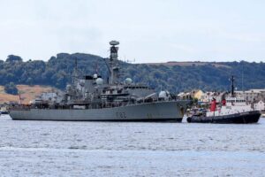 HMS Somerset being guided back into port at the end of her four-month TAPS mission.