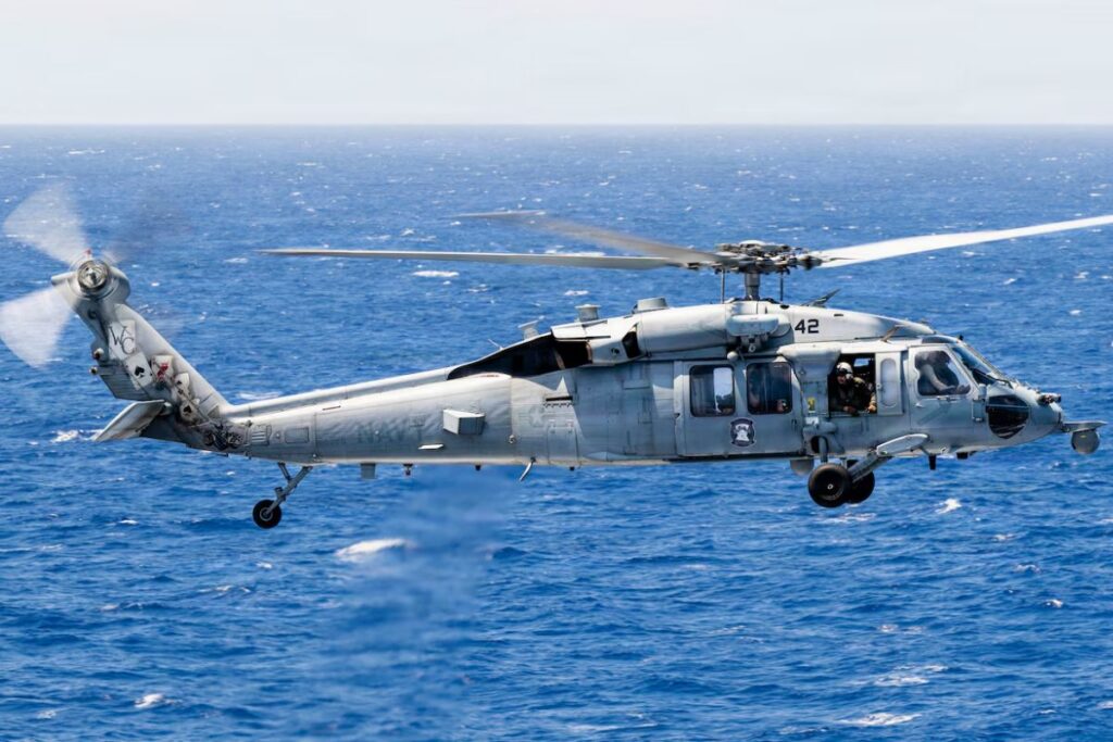 A U.S. Navy MH-60S Seahawk about to land on the flight deck of Nimitz-class aircraft carrier USS Theodore Roosevelt during Exercise Rim of the Pacific 2026.