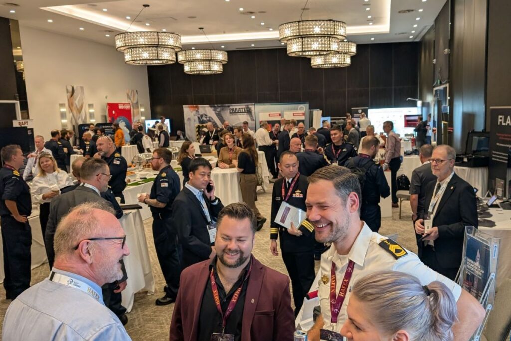 All smiles — delegates in the NDC 2026 exhibition area.