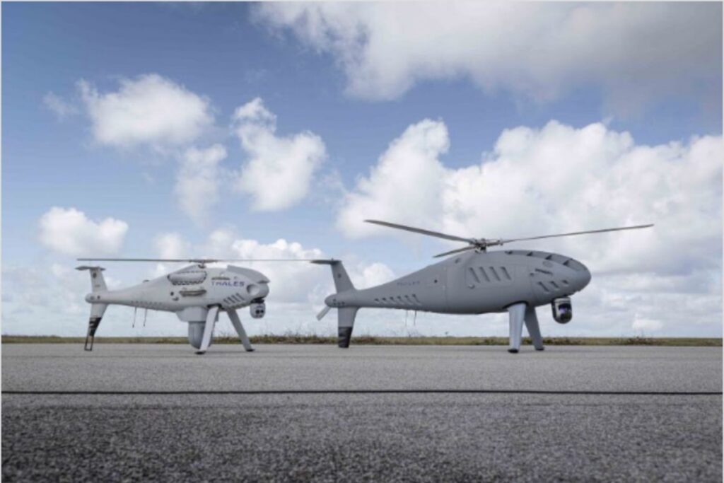 Schiebel’s S-300 uncrewed aerial system (right), pictured here alongside a sister S-100 UAS platform, has carried out its first U.K. flight.