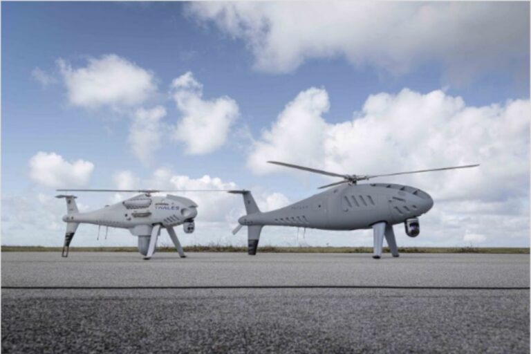 Schiebel’s S-300 uncrewed aerial system (right), pictured here alongside a sister S-100 UAS platform, has carried out its first U.K. flight.