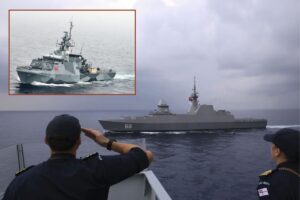 HMS Tamar’s CO Commander Tom Lindsey salutes Singapore's RSS Intrepid as she sails past; inset, the British warship on patrol in the South China Sea.